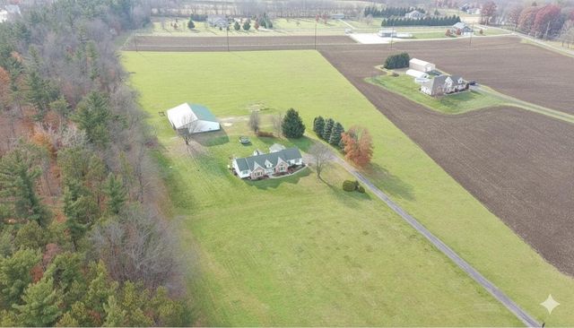 a view of a lake with a yard