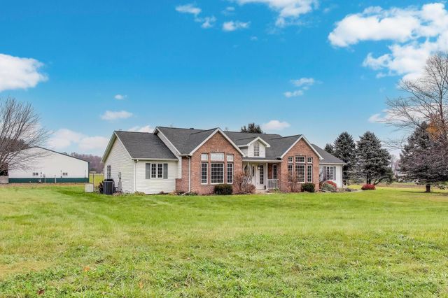 a fire hydrant in the middle of a field