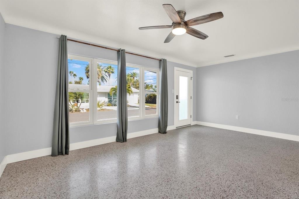 203 163rd Avenue Redington Beach, FL 33708 - Photo 11 of 31 a view of a livingroom with a ceiling fan and window