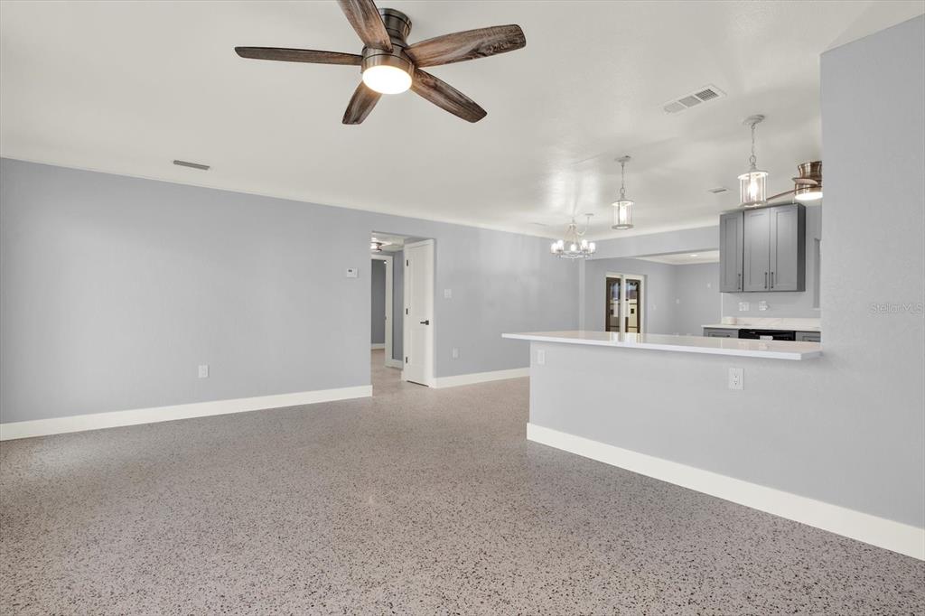 203 163rd Avenue Redington Beach, FL 33708 - Photo 12 of 31 a view of a kitchen with a sink and a ceiling fan