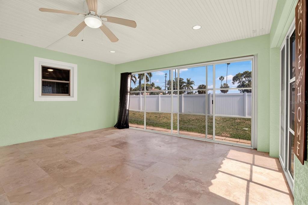 203 163rd Avenue Redington Beach, FL 33708 - Photo 25 of 31 a view of a livingroom with a ceiling fan and window
