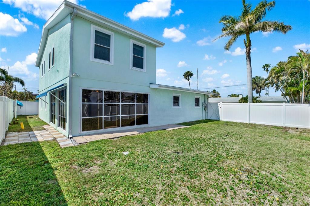 203 163rd Avenue Redington Beach, FL 33708 - Photo 27 of 31 a view of a house with a yard and potted plants