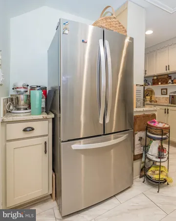 a kitchen with stainless steel appliances a stove and cabinets