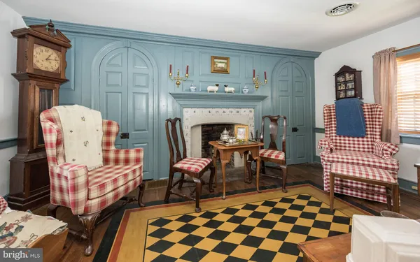a bed room with furniture and a chandelier