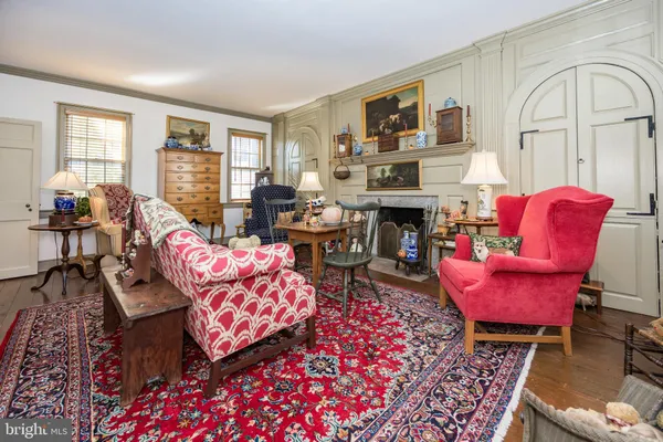a living room with furniture fireplace and flat screen tv