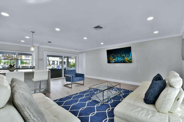 839 Enfield Street Boca Raton, FL 33487 - Photo 7 of 36 a living room with furniture and a flat screen tv