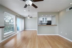 18617 Egret Bay Boulevard, Unit 708 Webster, TX 77058 - Photo 2 of 19 Living area leading to dining area