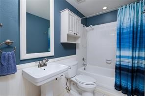 18617 Egret Bay Boulevard, Unit 708 Webster, TX 77058 - Photo 7 of 19 a bathroom with a sink toilet and shower