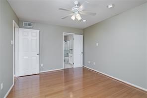 18617 Egret Bay Boulevard, Unit 708 Webster, TX 77058 - Photo 8 of 19 wooden floor in an empty room with a window
