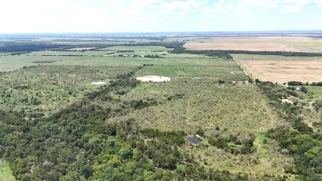 a view of a lake with houses in the back