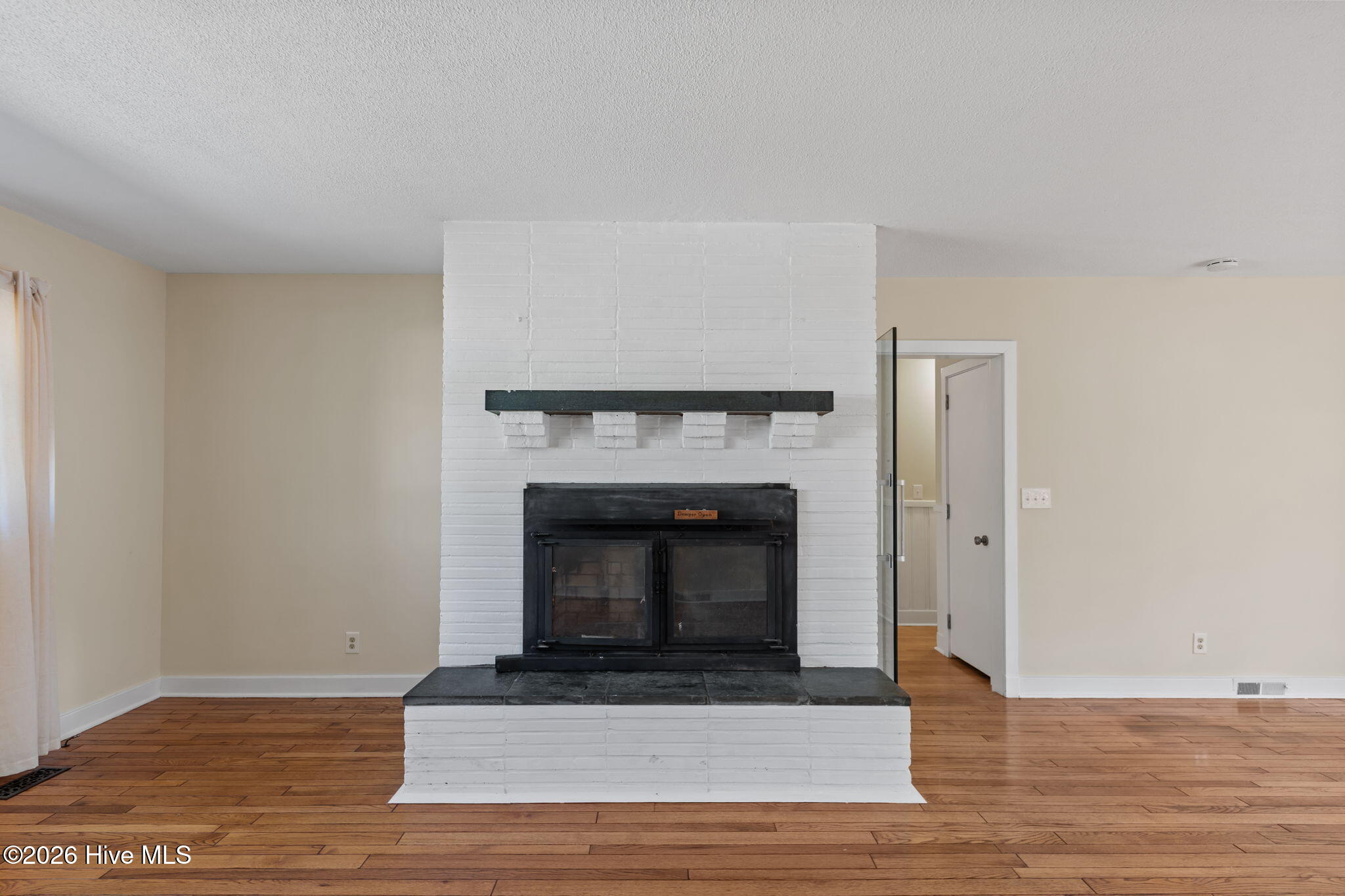 1010 Bion Butler Road Aberdeen, NC 28315 - Photo 21 of 62 Living room fireplace for cozy nights