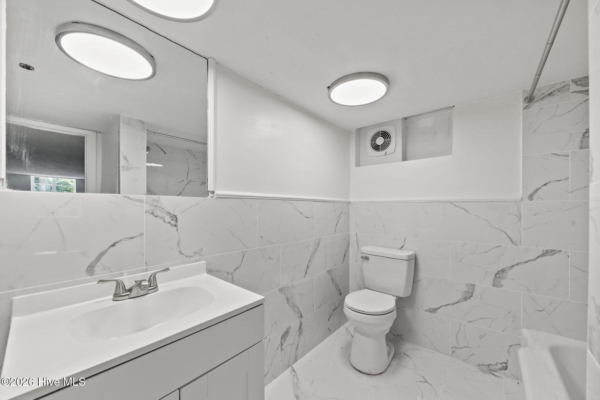 1010 Bion Butler Road Aberdeen, NC 28315 - Photo 42 of 62 Additional bathroom featuring new tilework!