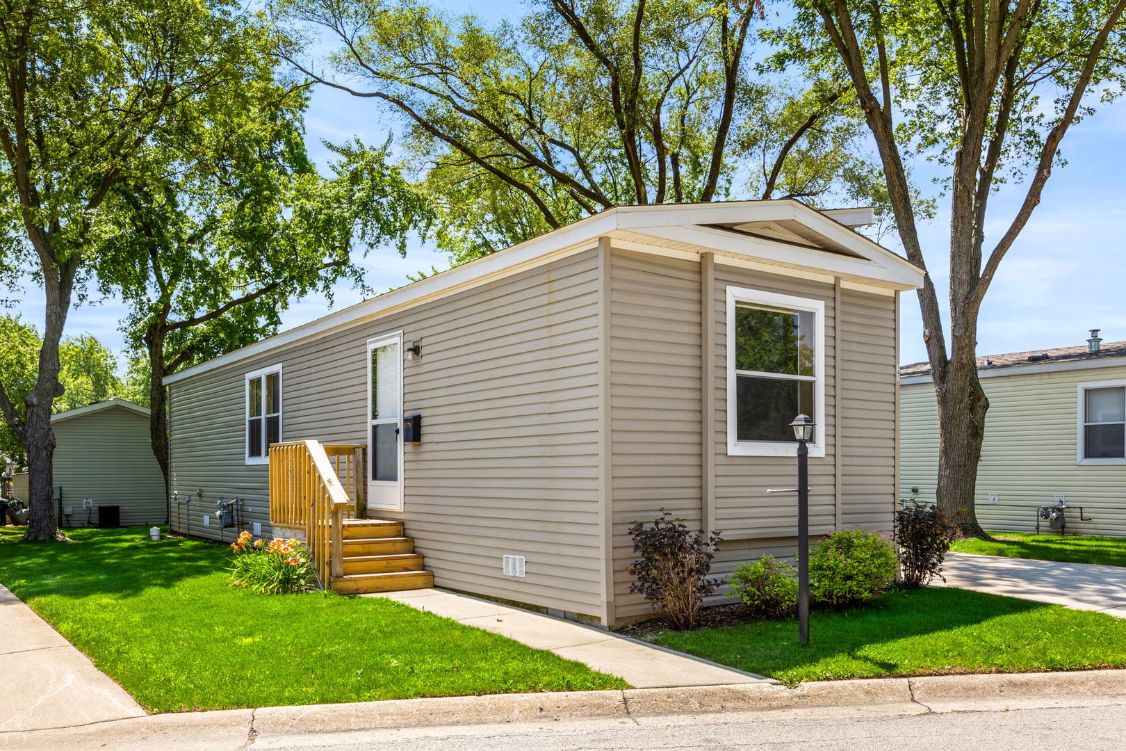 147 Parkwood Road Elgin, IL 60123 - Photo 1 of 16 a front view of house with yard and green space