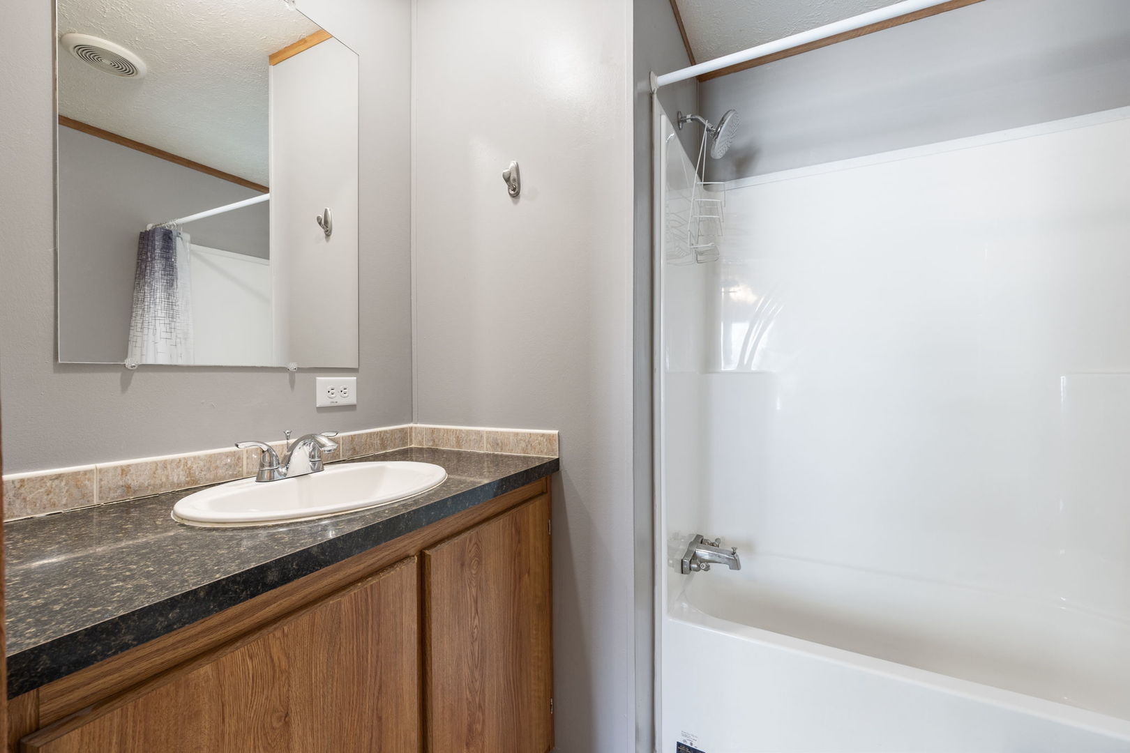 147 Parkwood Road Elgin, IL 60123 - Photo 11 of 16 a bathroom with a granite countertop sink and a mirror