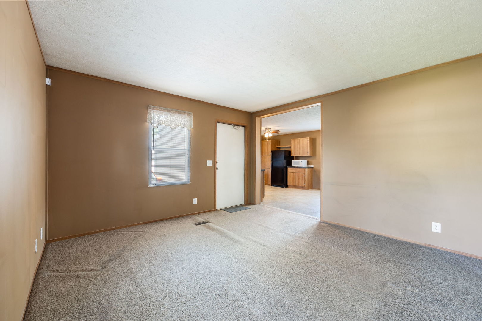 147 Parkwood Road Elgin, IL 60123 - Photo 3 of 16 a view of an empty room with a window