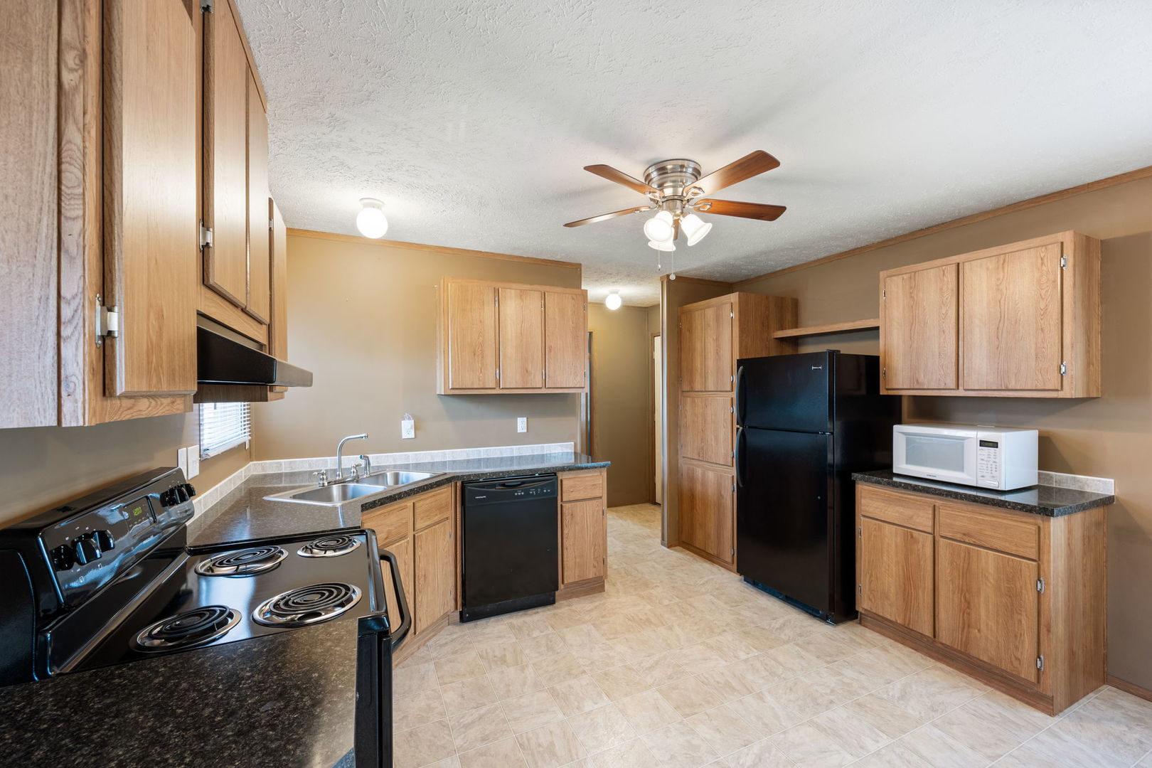 147 Parkwood Road Elgin, IL 60123 - Photo 7 of 16 a kitchen with a sink stainless steel appliances and counter space