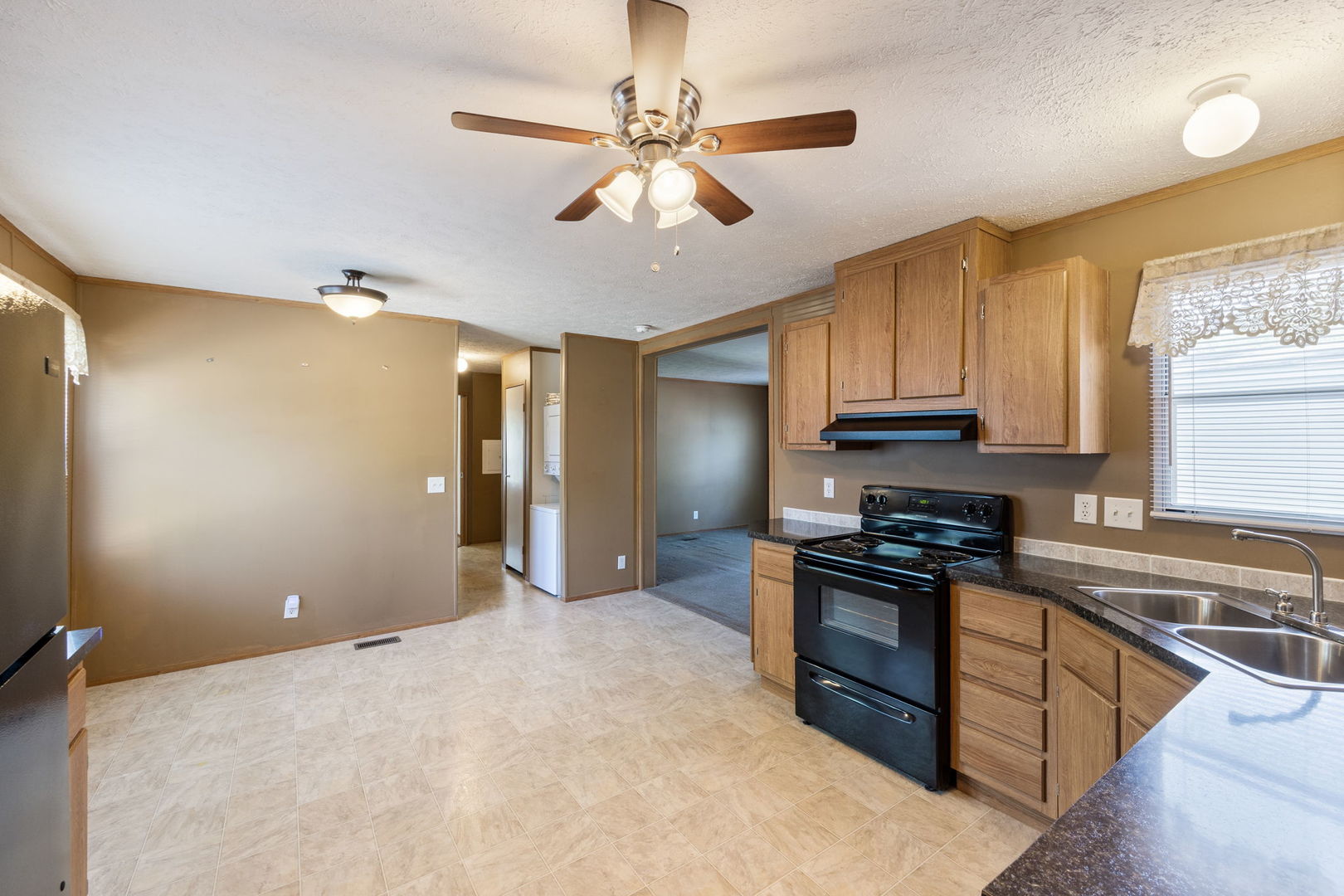 147 Parkwood Road Elgin, IL 60123 - Photo 8 of 16 a kitchen with stainless steel appliances granite countertop a sink a stove a refrigerator cabinets and a dining table