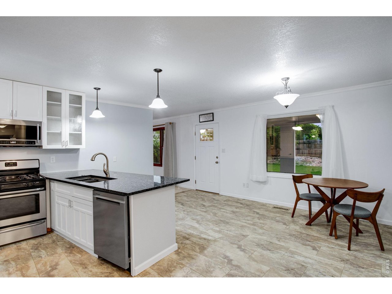 5416 South Timberline Road Fort Collins, CO 80528 - Photo 11 of 50 Granite slab countertops with a breakfast bar