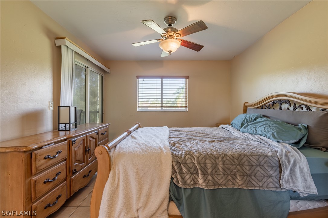 8162 Country Road, Unit 203 Fort Myers, FL 33919 - Photo 13 of 22 a bedroom with a bed and window