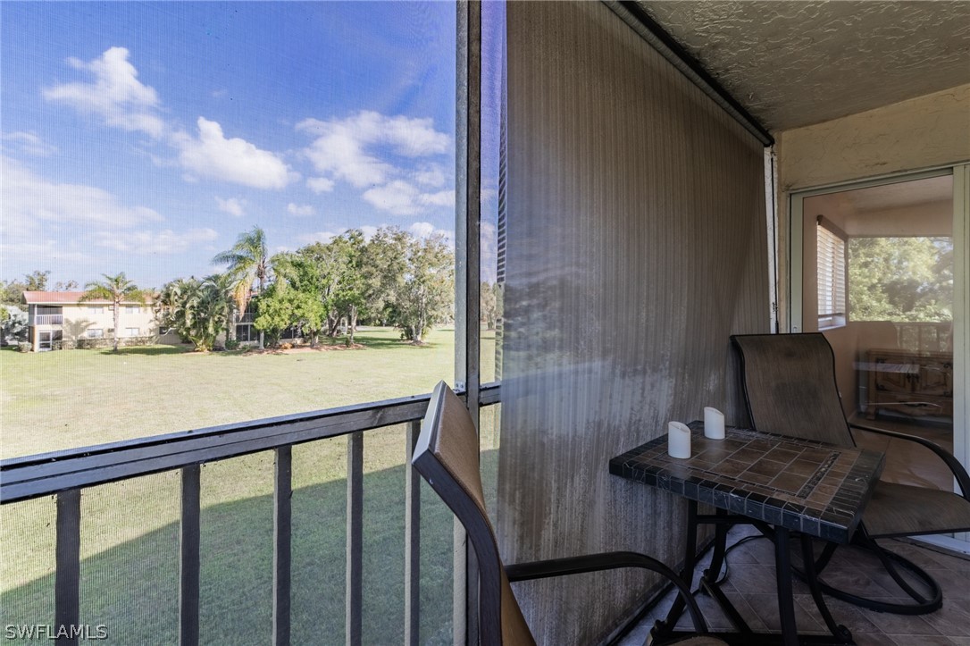 8162 Country Road, Unit 203 Fort Myers, FL 33919 - Photo 17 of 22 a view of a balcony with furniture