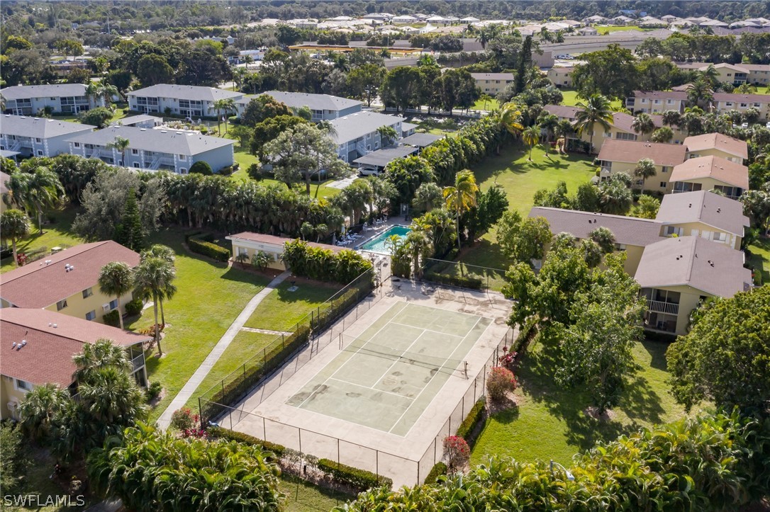 8162 Country Road, Unit 203 Fort Myers, FL 33919 - Photo 19 of 22 an aerial view of a house with a garden and swimming pool