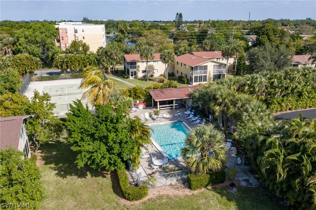 8162 Country Road, Unit 203 Fort Myers, FL 33919 - Photo 20 of 22 an aerial view of multiple houses with yard
