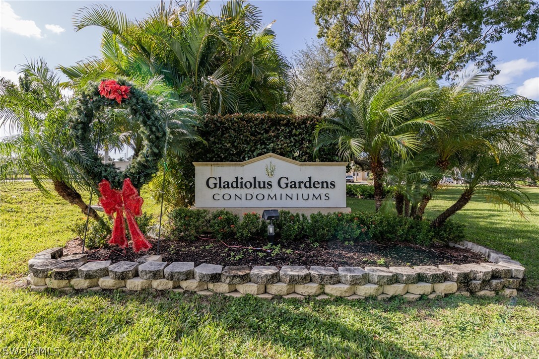 8162 Country Road, Unit 203 Fort Myers, FL 33919 - Photo 22 of 22 a view of sign board with plants and trees