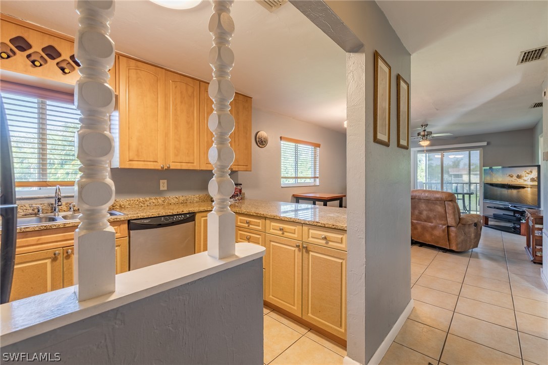 8162 Country Road, Unit 203 Fort Myers, FL 33919 - Photo 3 of 22 a kitchen with stainless steel appliances granite countertop a sink and a stove