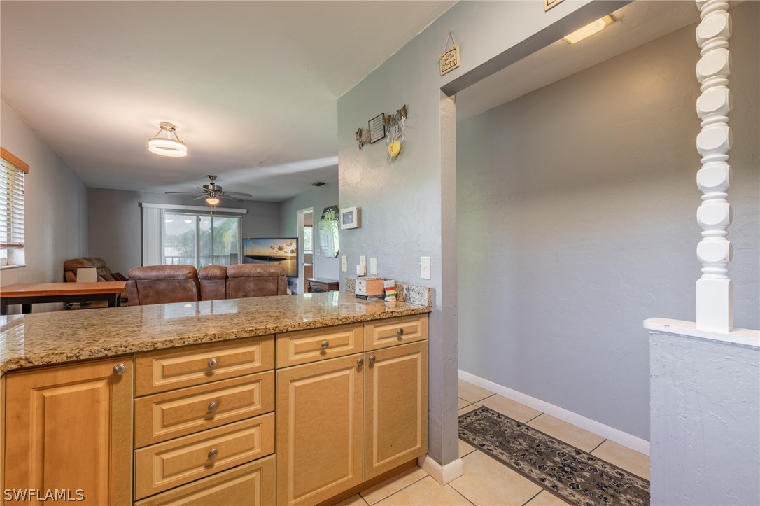 8162 Country Road, Unit 203 Fort Myers, FL 33919 - Photo 5 of 22 a bathroom with a granite countertop sink and a mirror