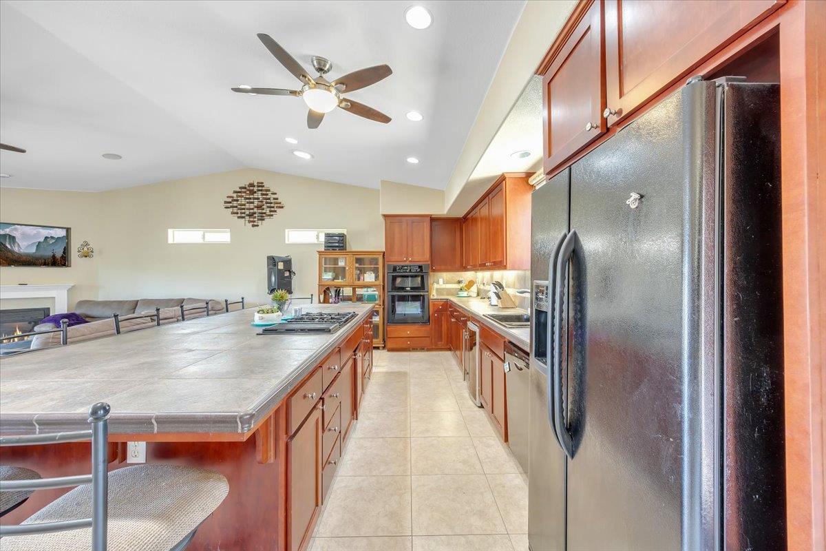 411 Sunrise Road Copperopolis, CA 95228 - Photo 24 of 76 Cabinets galore on both sides of the island for the ultimate storage.