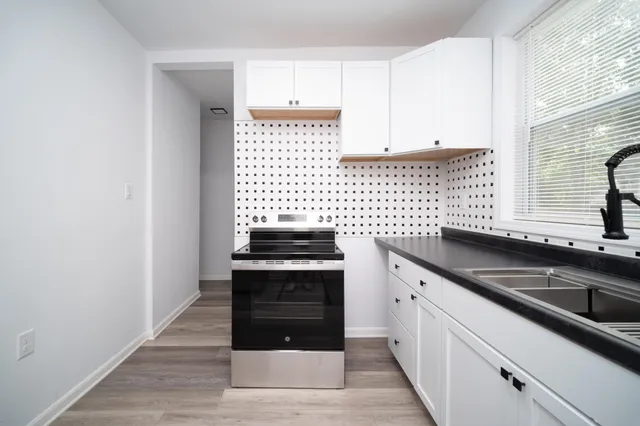a kitchen with a sink and cabinets