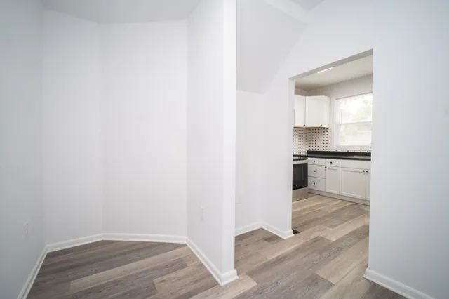 a view of kitchen with wooden floor