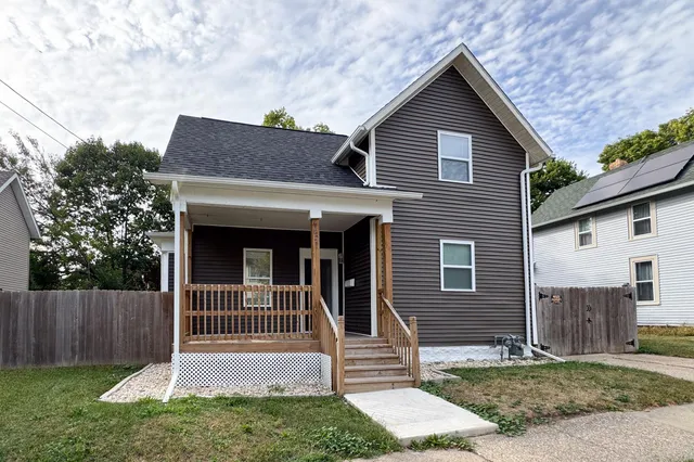 a front view of a house with a porch