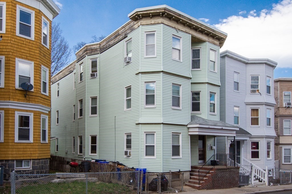 15 Hecla Street Boston, MA 02122 - Photo 1 of 33 a front view of a residential apartment building with a yard