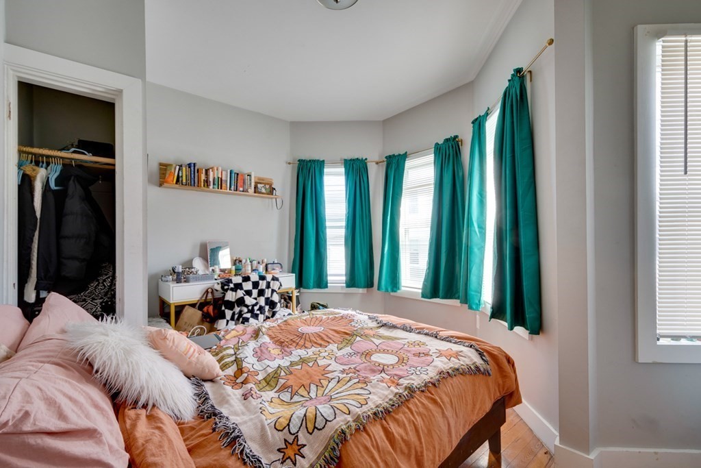 15 Hecla Street Boston, MA 02122 - Photo 13 of 33 a bedroom with a bed and a large window