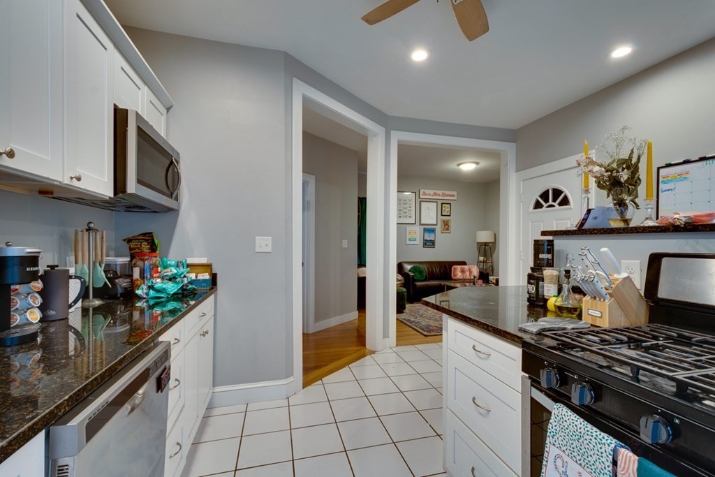 15 Hecla Street Boston, MA 02122 - Photo 16 of 33 a kitchen with a stove and a refrigerator