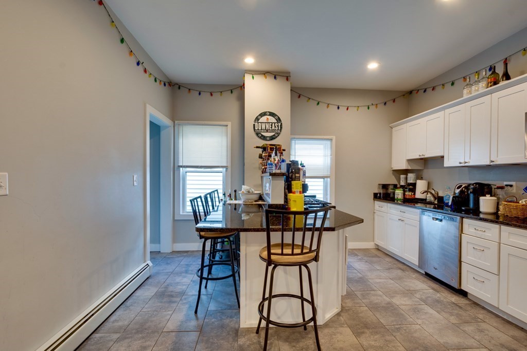 15 Hecla Street Boston, MA 02122 - Photo 2 of 33 a view of a kitchen with a dining table chairs and entryway