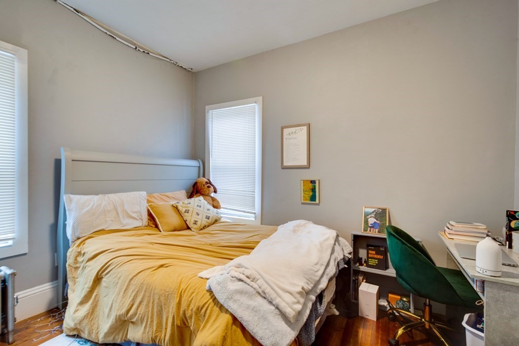 15 Hecla Street Boston, MA 02122 - Photo 22 of 33 a bedroom with a bed and a lamp