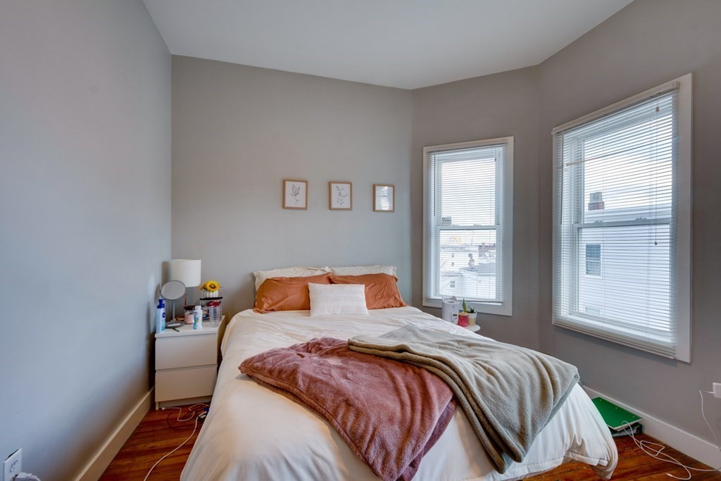 15 Hecla Street Boston, MA 02122 - Photo 24 of 33 a bedroom with a large bed and a window
