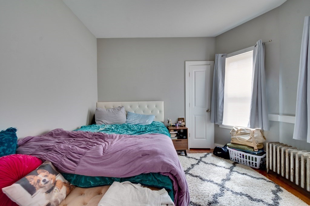 15 Hecla Street Boston, MA 02122 - Photo 25 of 33 a bedroom with a bed and a window