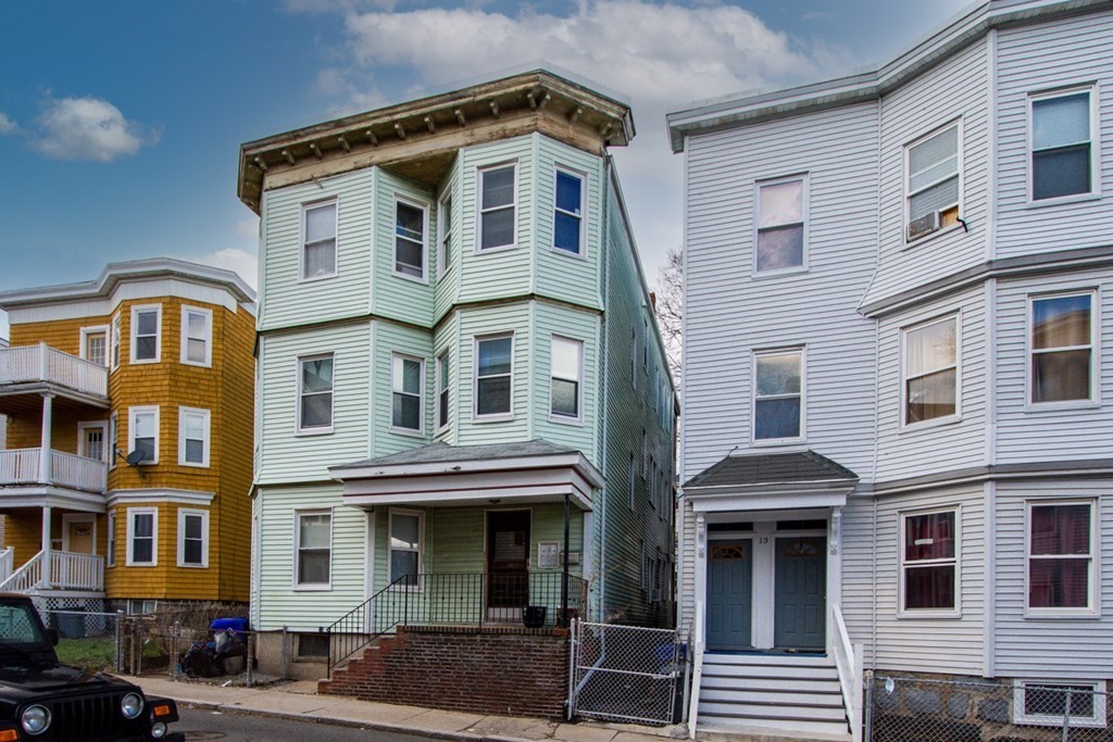 15 Hecla Street Boston, MA 02122 - Photo 30 of 33 a front view of a residential apartment building with a yard