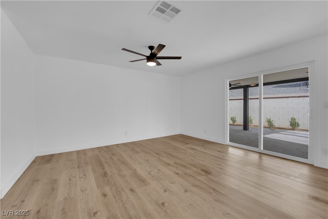 3228 Robin Circle Las Vegas, NV 89121 - Photo 11 of 45 Spare room with visible vents, light wood-style fl
