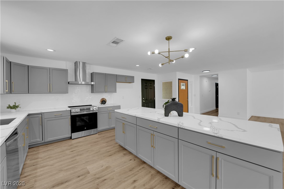 3228 Robin Circle Las Vegas, NV 89121 - Photo 14 of 45 Kitchen with visible vents, gray cabinetry, decora