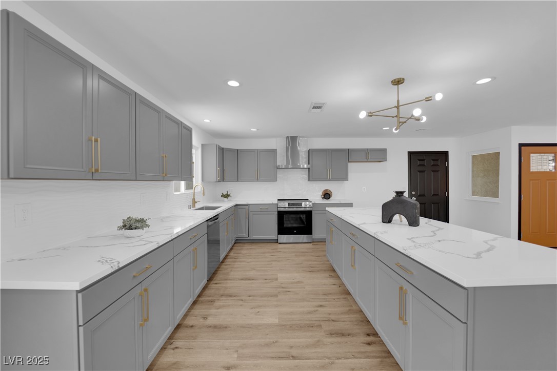 3228 Robin Circle Las Vegas, NV 89121 - Photo 15 of 45 Kitchen featuring light wood finished floors, gray