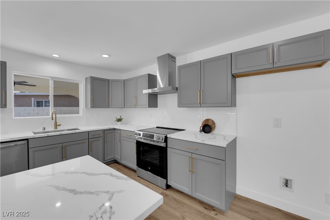 3228 Robin Circle Las Vegas, NV 89121 - Photo 17 of 45 Kitchen featuring light stone counters, gray cabin