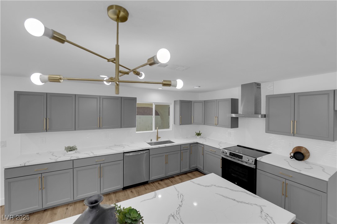 3228 Robin Circle Las Vegas, NV 89121 - Photo 19 of 45 Kitchen with gray cabinetry, a sink, stainless ste