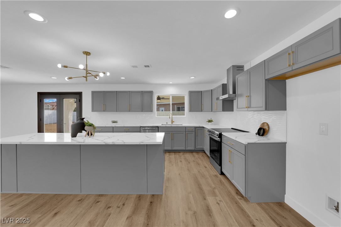 3228 Robin Circle Las Vegas, NV 89121 - Photo 20 of 45 Kitchen featuring light stone countertops, gray ca