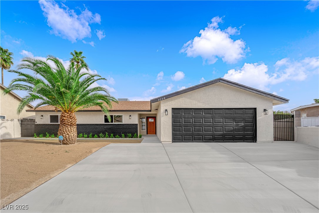 3228 Robin Circle Las Vegas, NV 89121 - Photo 2 of 45 Ranch-style home with stucco siding, driveway, a g