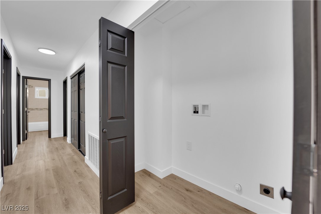 3228 Robin Circle Las Vegas, NV 89121 - Photo 23 of 45 Corridor with light wood-type flooring, baseboards