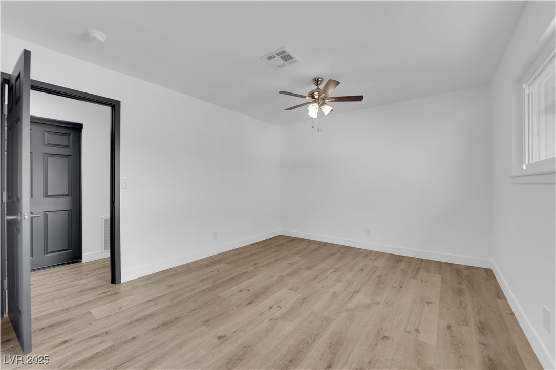 3228 Robin Circle Las Vegas, NV 89121 - Photo 24 of 45 Empty room with visible vents, baseboards, light w